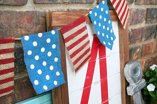 A 4th of July nanner made with strips of burlap painted with Chalky Finish paint