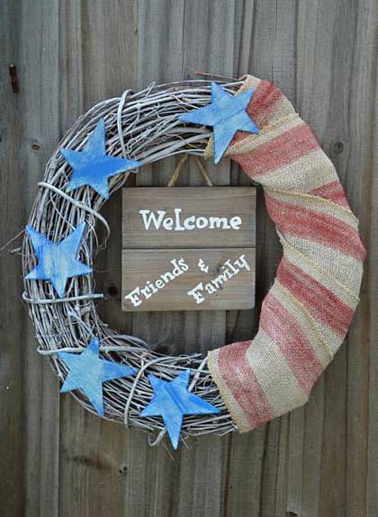 A rustic patriotic wreath made of twigs and some blue and red twine