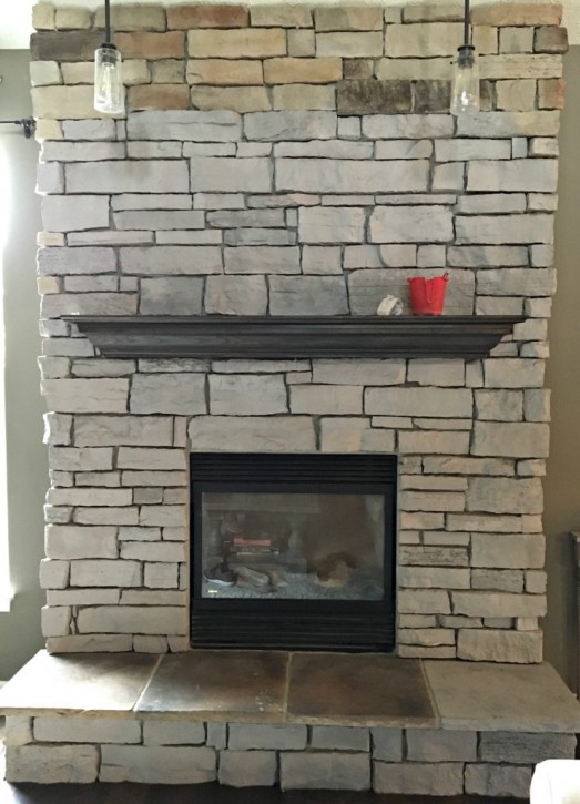 Painting a stone fireplace in progress
