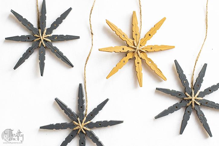 Craft wooden snowflakes from clothespins painted with white color, reusable  DIY New Year ornament Stock Photo by maria_symchychnavr