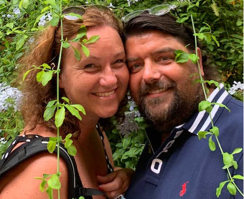 A picture of Swiss artist Kartika and her husband smiling