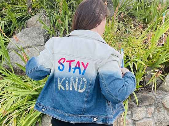 A jean jacket with the words 