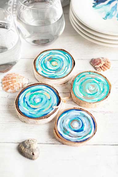 Wooden coasters painted in coastal colors