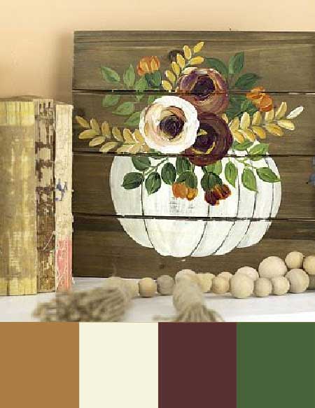 A white pumpkin with flowers sprouting out of it painted onto a wood pallet board.