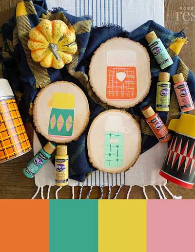 Wood slices are painted with vintage looking thermoses in fall colors. Beneath this is a color palette with orange, dark teal, lime green, and pink.