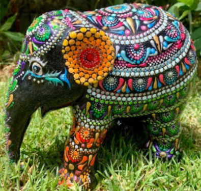 An elephant painted with a mandala pattern