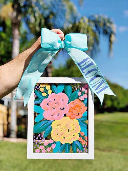 A glass frame is painted and turned into a floral print suncatcher