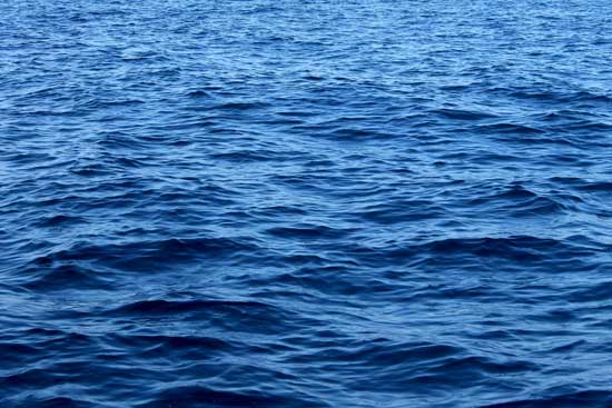 A close-up of the deep ocean with gentle waves.