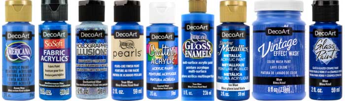 A line-up of different DecoArt acrylic paint bottles in colors similar to ocean blue.