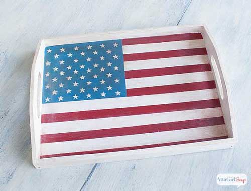 A serving tray with an american flag painted on it