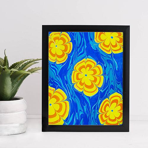 A framed water marbling print of flowers