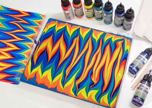 A rainbow water marbling print with a gelgit pattern.