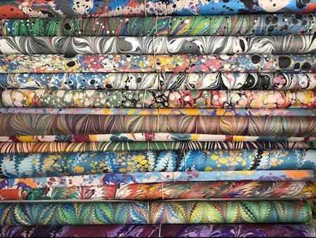 A stack of water marbling papers from Mercedes Rex.