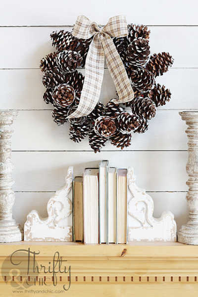 A wreath made of pinecones dipped in warm white paint